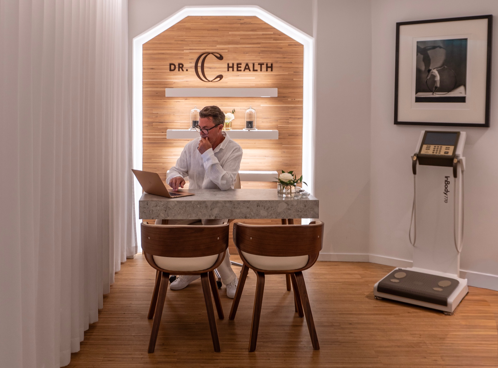 Dr. Charles Randquist at the Dr. C Health consultation desk